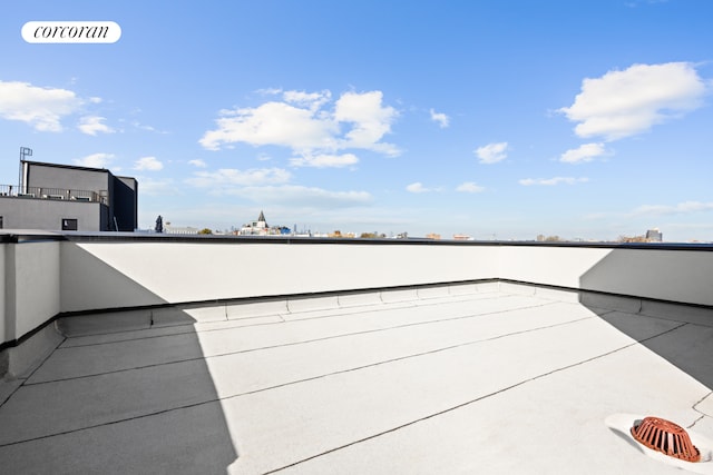 view of patio featuring a view of city and a balcony