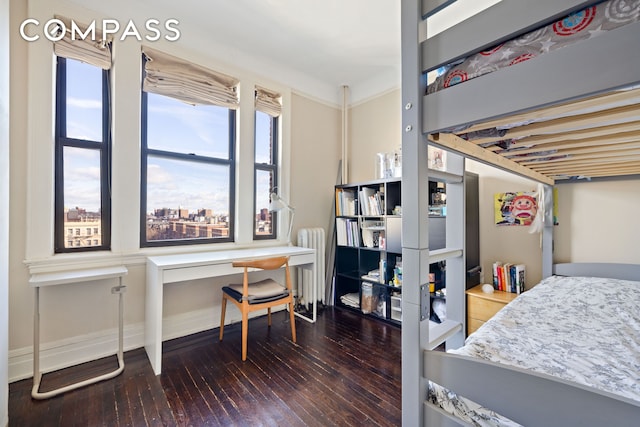 270 Convent Ave Unit 8B, New York City, NY 10031 - bedroom with hardwood / wood-style floors, baseboards, and radiator heating unit