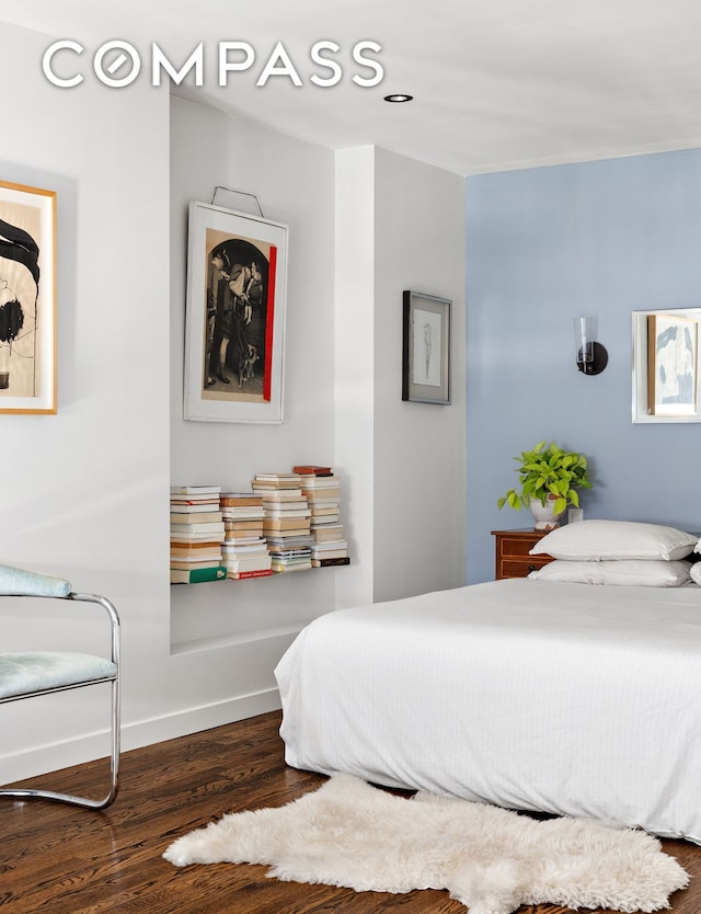 211 Thompson St Unit Ph6D, New York City, NY 10012 - bedroom with wood finished floors and baseboards