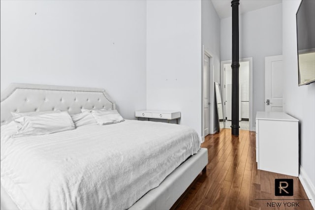 bedroom featuring dark wood finished floors