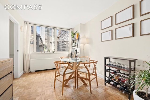 dining space featuring baseboards