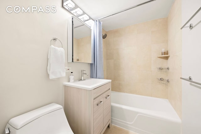 bathroom featuring vanity, shower / tub combination, and toilet