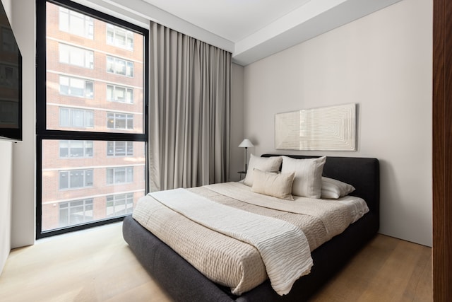 bedroom featuring light wood finished floors