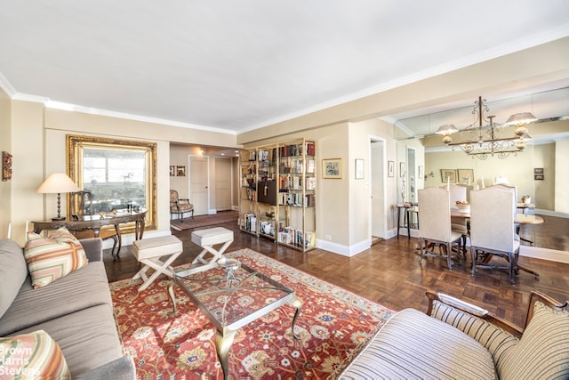 living area featuring crown molding, an inviting chandelier, and baseboards