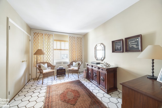 sitting room featuring light floors