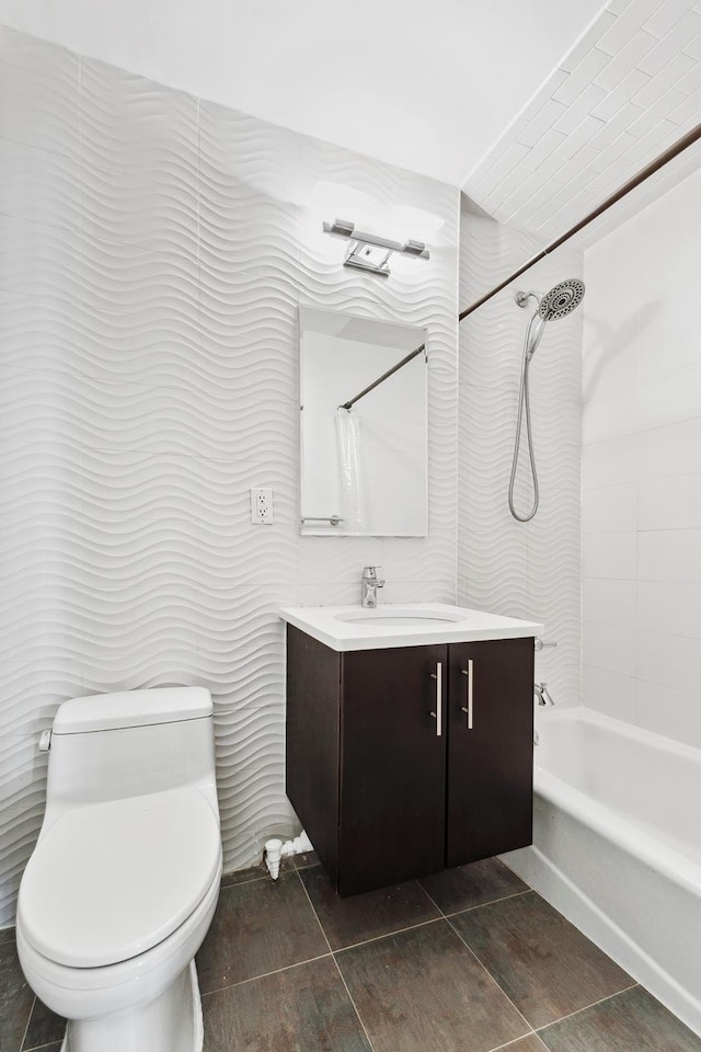 full bathroom featuring bathing tub / shower combination, toilet, and vanity