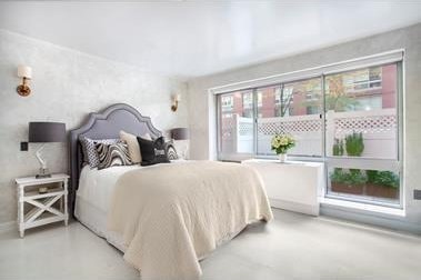 bedroom with finished concrete floors