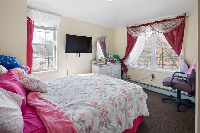 bedroom with carpet and baseboard heating