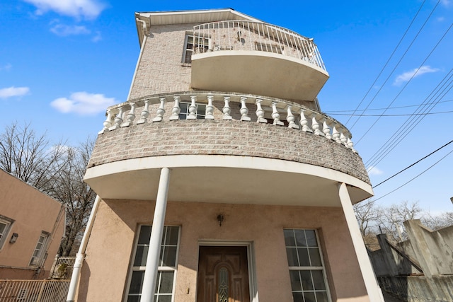 view of building exterior with fence