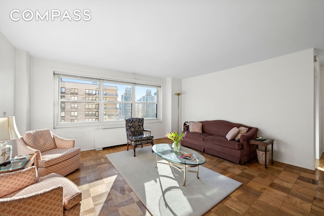 living area with a view of city and radiator