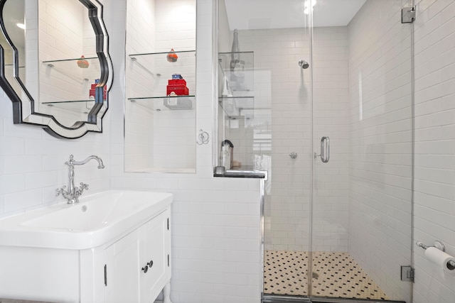 577 Madison St Unit 4B, New York City, NY 11221 - full bath featuring tile walls, vanity, and a stall shower