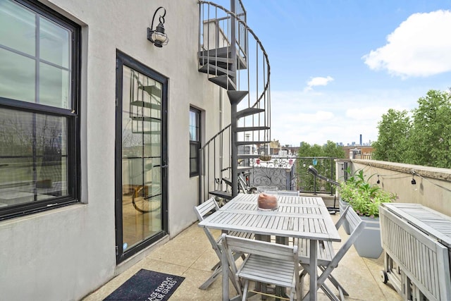 577 Madison St Unit 4B, New York City, NY 11221 - balcony featuring stairs and outdoor dining area