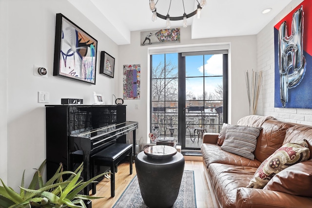 577 Madison St Unit 4B, New York City, NY 11221 - living area featuring wood finished floors and a chandelier
