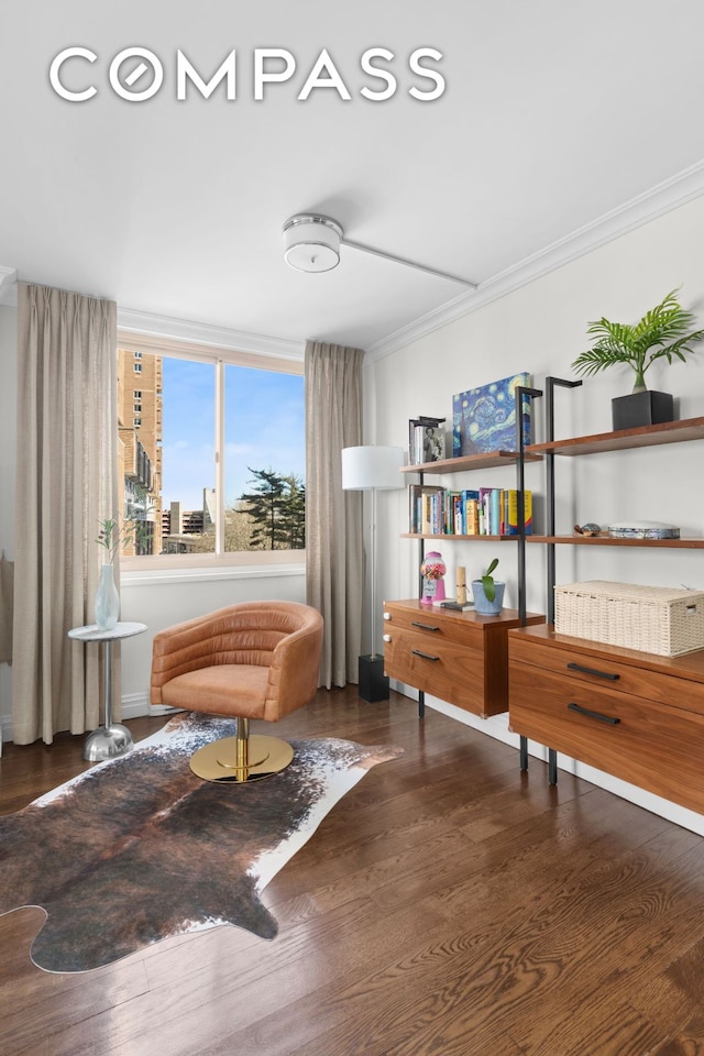 living area with a view of city, ornamental molding, and dark wood finished floors