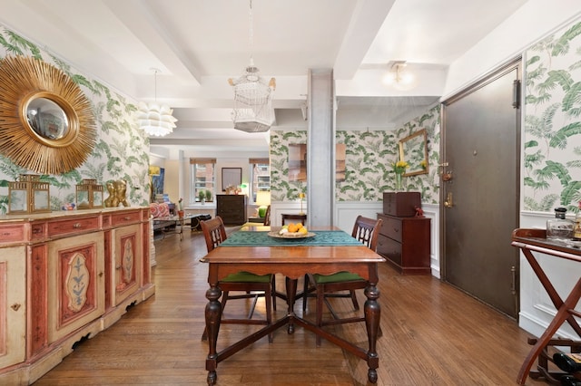 321 E 54th St Unit 2Bc, New York City, NY 10022 - dining space featuring a chandelier, wood finished floors, and wallpapered walls