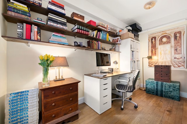 office with baseboards and hardwood / wood-style flooring