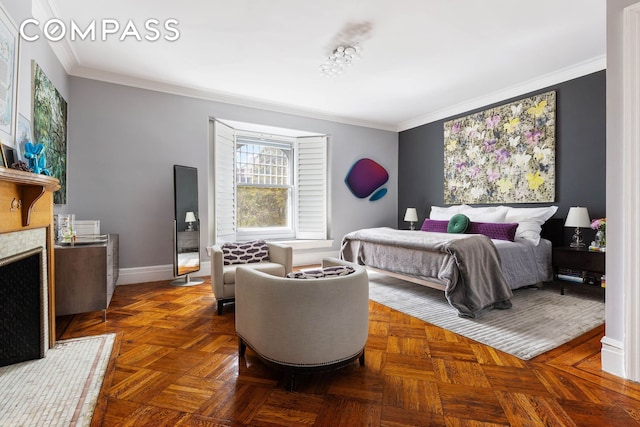 bedroom with a fireplace with flush hearth, baseboards, and crown molding