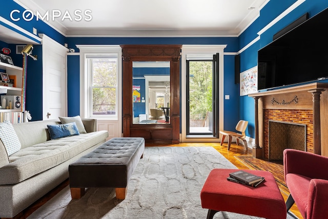 living room featuring a fireplace with flush hearth and ornamental molding