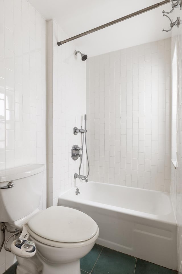 full bath with toilet, tile patterned flooring, and shower / tub combination