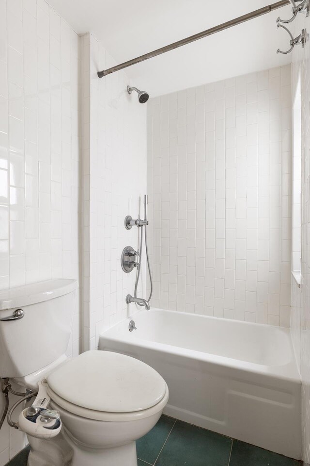 626 E 14th St Unit 11/12, New York City, NY 10009 - bathroom featuring toilet, tile patterned flooring, and shower / tub combination