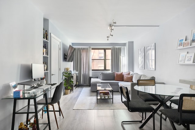 210 E 15th St Unit 5G, New York City, NY 10003 - dining space with light wood-type flooring, an office area, and rail lighting