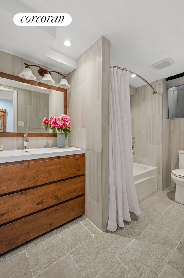 bathroom with recessed lighting, visible vents, toilet, shower / tub combo, and vanity