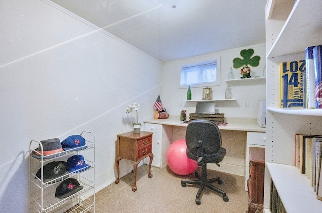 carpeted home office with built in study area