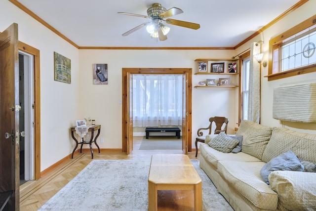 living room featuring baseboards, a ceiling fan, and crown molding