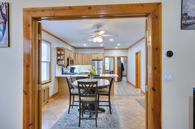 dining space with crown molding, recessed lighting, ceiling fan, and baseboards