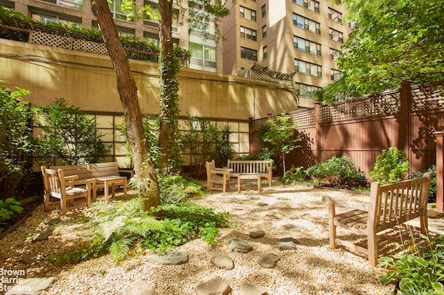 view of patio with fence and an outdoor hangout area