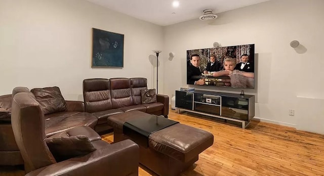living room featuring baseboards and wood finished floors