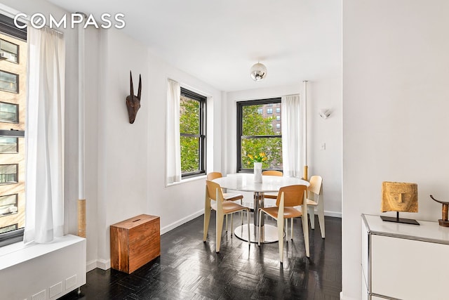 dining space featuring baseboards