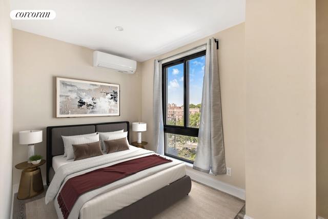 bedroom with a wall mounted air conditioner, visible vents, and baseboards