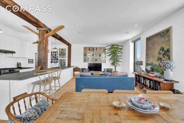 dining space featuring recessed lighting and light wood-style floors