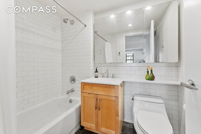 full bathroom with toilet, vanity, tile walls, backsplash, and shower / bath combination with curtain