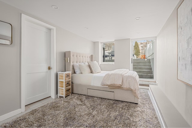 bedroom with tile patterned flooring, recessed lighting, and baseboards