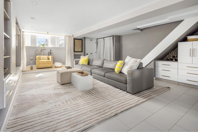 living area with tile patterned floors