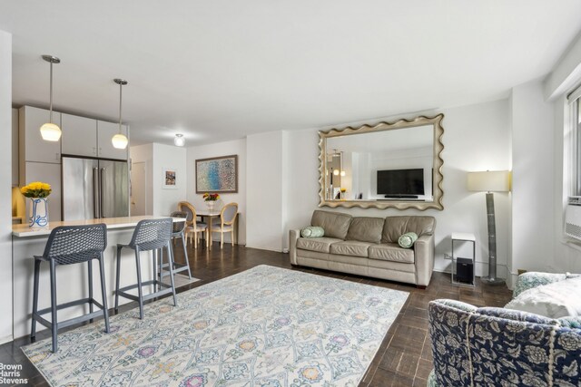 living room featuring dark wood-type flooring