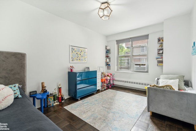 bedroom with radiator heating unit and cooling unit