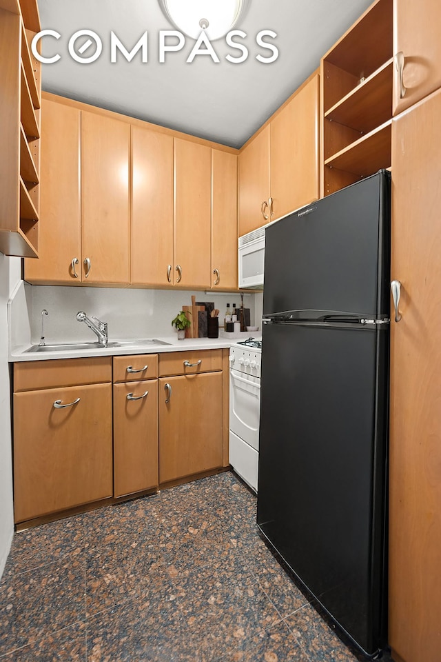 kitchen with open shelves, light countertops, light brown cabinetry, a sink, and white appliances