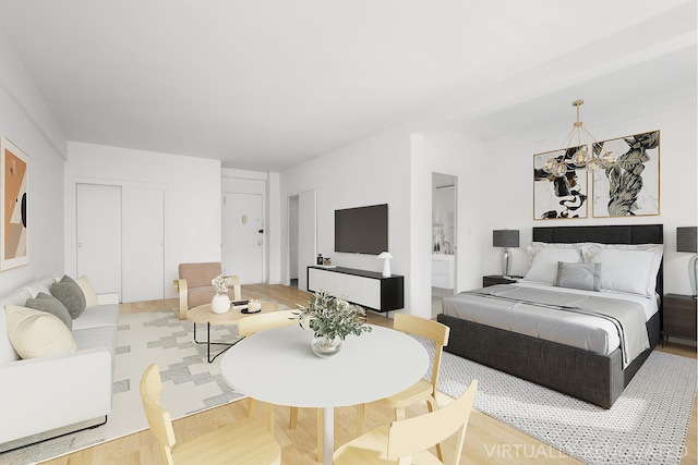 bedroom with light wood-style floors and a closet