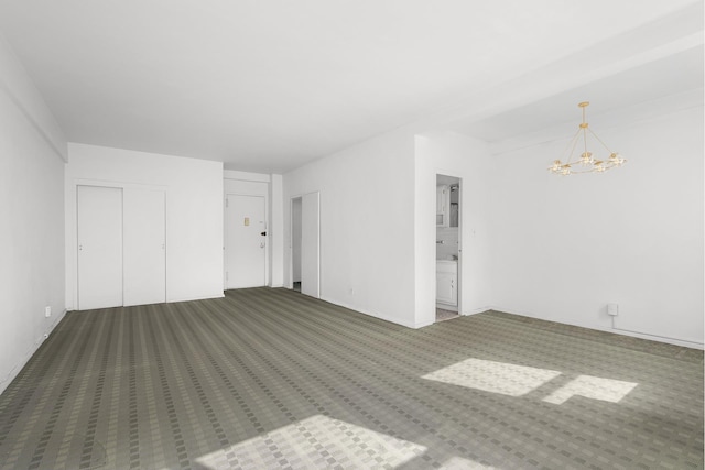 interior space with carpet flooring and an inviting chandelier