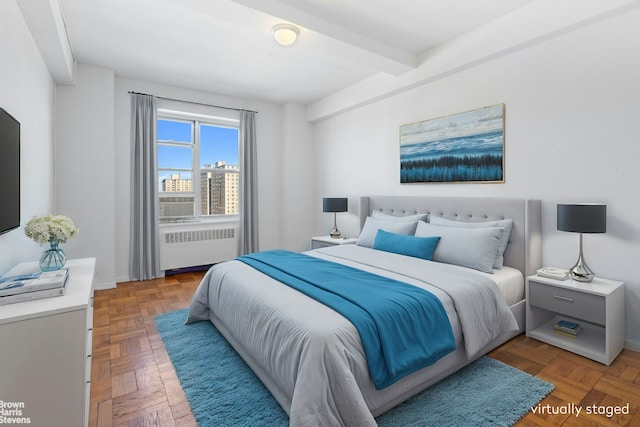bedroom with radiator and beam ceiling