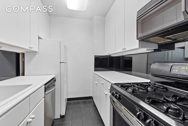 kitchen with stainless steel dishwasher, range with gas cooktop, white cabinets, black microwave, and light countertops