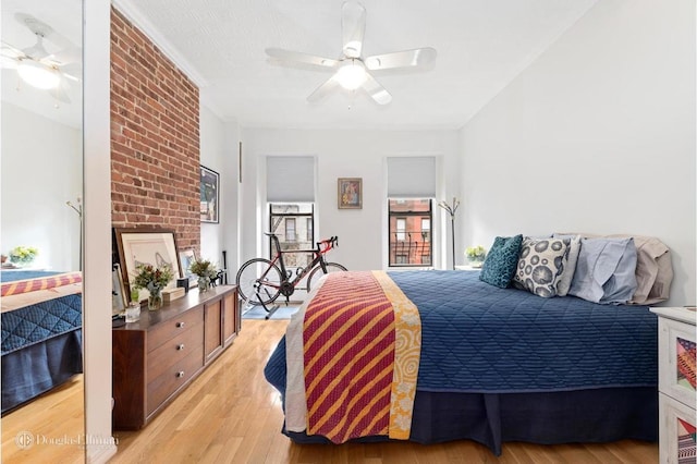 bedroom featuring light wood finished floors and a ceiling fan