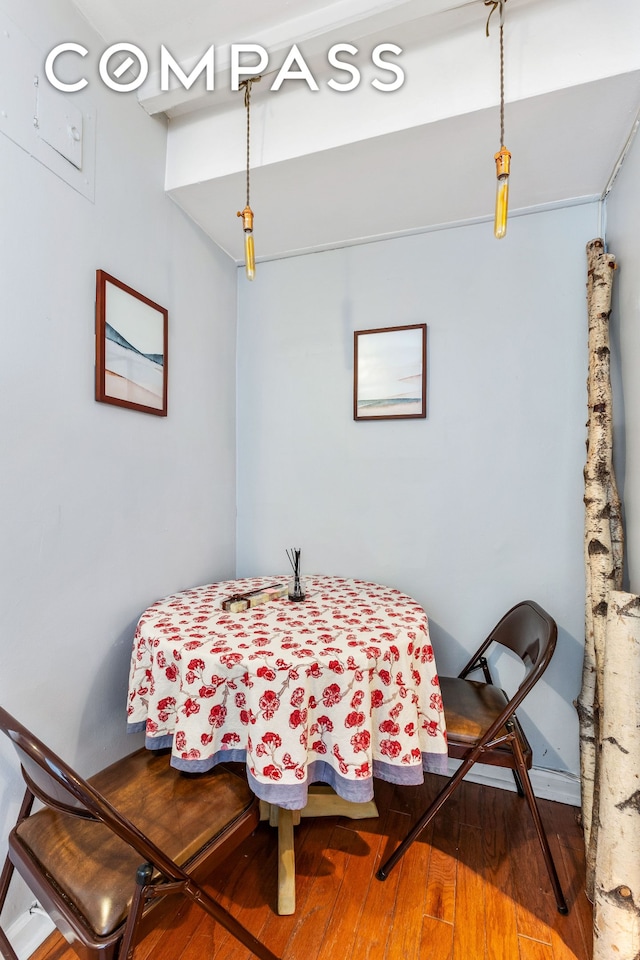 dining space featuring wood finished floors