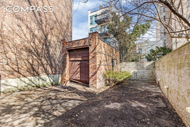 view of outdoor structure featuring fence