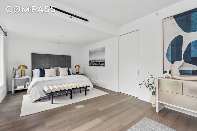 bedroom featuring wood finished floors