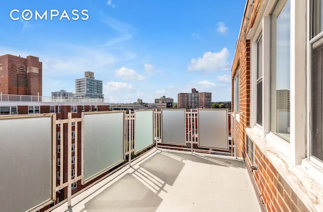 balcony featuring a city view