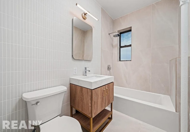 full bath featuring tile walls,  shower combination, toilet, and vanity